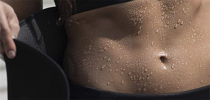 sweating woman holding slimwaist