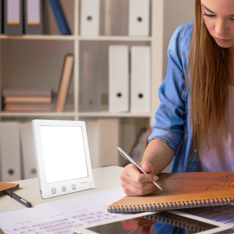 testimonial image of girl drawing with Moodozi SAD Lamp