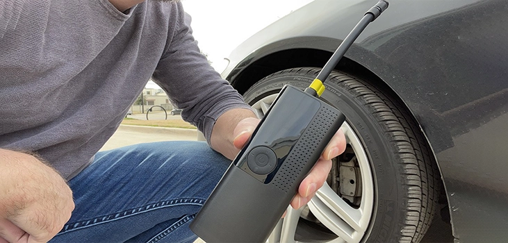 a man ready to inflate his tire with airmoto