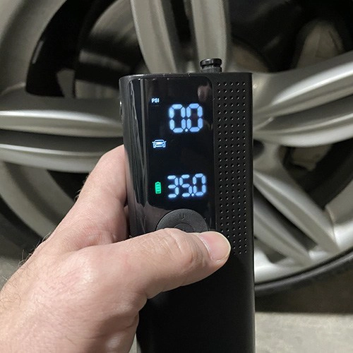 a man setting the desired settings on airmoto