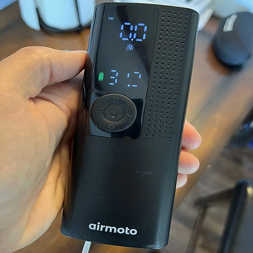 a man holding airmoto