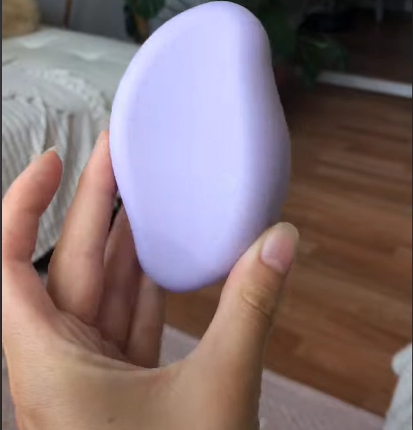 shinezskin testimonial woman holding the product