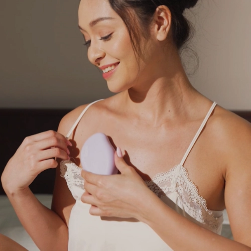 woman rubbing shinezskin in her chest